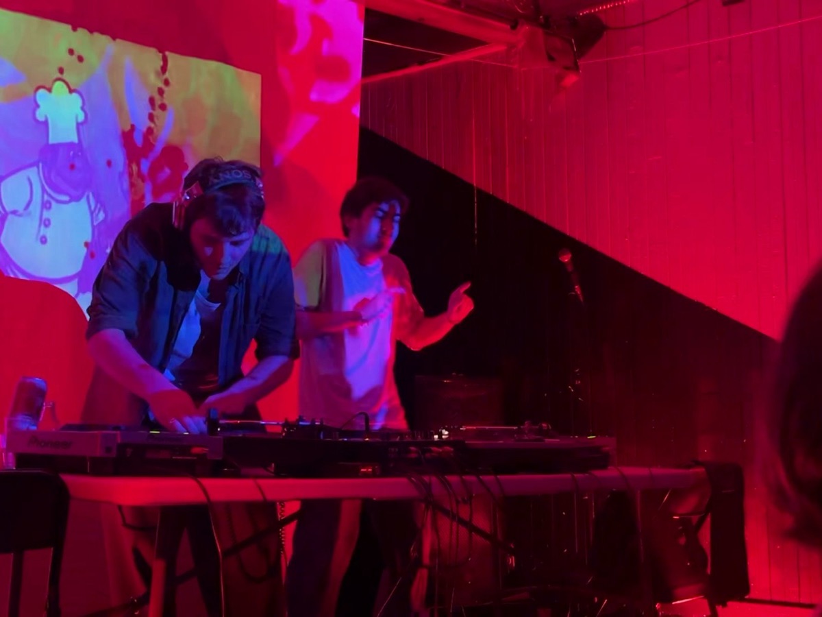 DJing in front of a projected illustrated world